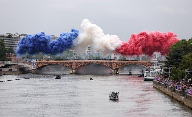Smoke resembling the flag of Team France is shown over Pont d’Austerlitz during the opening ceremony of the Olympic Games Paris 2024 on July 26, 2024 in Paris, France. (Photo by Lars Baron/Getty Images)