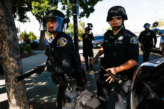Police try to push protesters back on East Santa Clara Street during a protest decrying the police killing of George Floyd in downtown San Jose on Friday, May 29, 2020. (Photo by Randy Vazquez/Bay Area News Group)