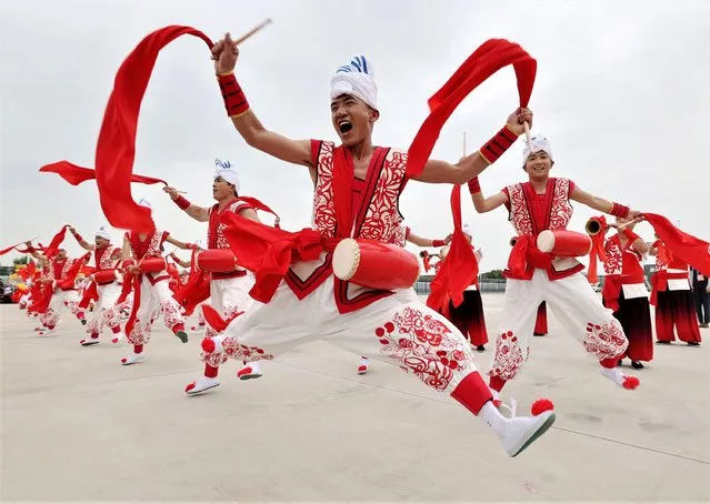 Shaanxi folk dancers perform during a welcoming ceremony for Tajik President Emomali Rahmon in Xi'an, northwest China's Shaanxi Province, on May 17, 2023. Tajik President Emomali Rahmon arrived in Xi'an on Wednesday afternoon for the China-Central Asia Summit, which is scheduled for May 18 and 19. (Photo by Xinhua News Agency/Rex Features/Shutterstock)