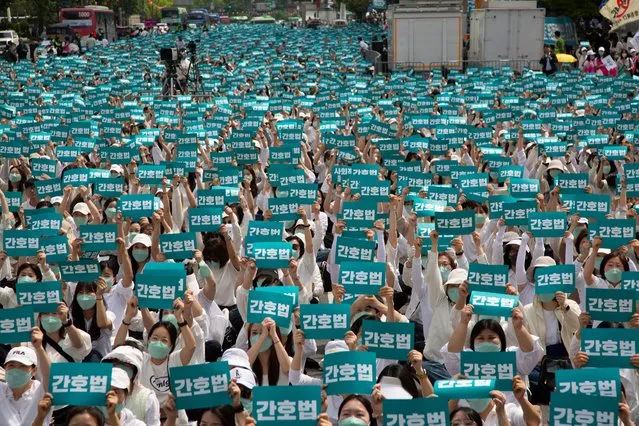 Members of Korean Nurses Association take part in a rally marking International Nurses Day in Seoul, South Korea, 12 May 2023. The rally was held to urge the government to promulgate the controversial amended nursing law. (Photo by Jeon Heon-Kyun/EPA/EFE)
