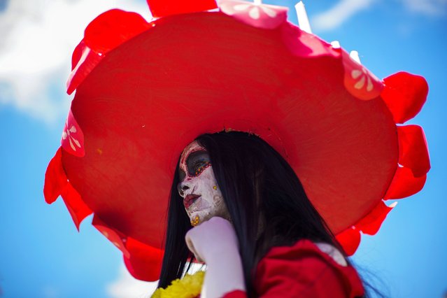 A reveler attends the annual zombie parade in Santiago, Chile, October 20, 2024. (Photo by Esteban Felix/AP Photo)