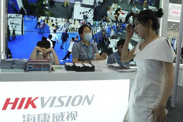 Surveillance camera maker Hikvision, one of the Chinese tech companies sanctioned by the U.S. government for its role in Beijing's crackdown in China's far west Xinjiang region, is seen promoting its technologies during the Security China 2023 in Beijing, on June 7, 2023. (Photo by Ng Han Guan/AP Photo)