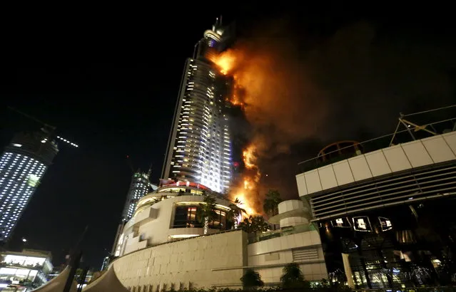 A fire engulfs The Address Hotel in downtown Dubai in the United Arab Emirates December 31, 2015. (Photo by Ahmed Jadallah/Reuters)