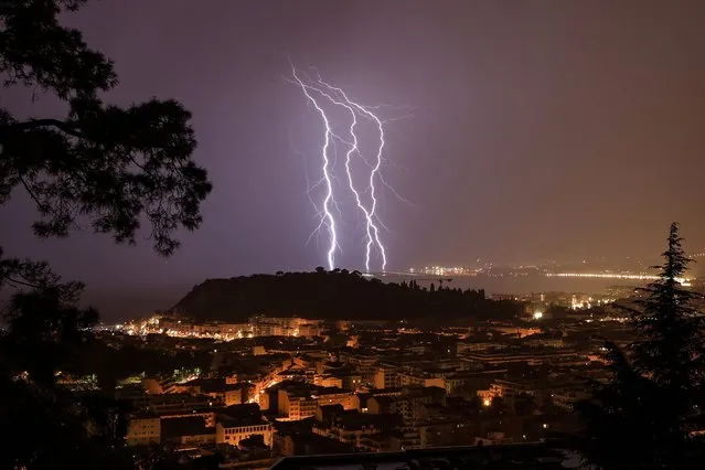 Lightning strikes over the French Riviera city of Nice, Southerneast France, on late Septembe 30, 2022. (Photo by Valery Hache/AFP Photo)