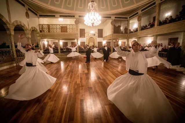 Whirling Dervishes take part in a Sema Prayer Ceremony at the Yenikapi Mevlevihanesi marking the anniversary of the death of Mevlana Jalal al-Din al-Rumi on December 17, 2018 in Istanbul, Turkey. December 17, 2018 marks the anniversary of the death of Mevlana Jalal al-Din al-Rumi, a poet and the founder of Sufism, a mystical form of Islam. Each year pilgrims come from all over the world to commemorate Rumi's death. Rumi, whose religion was love, was one of the world's most read poets, after his death in 1273 the order was continued by his sons and grandsons. Today pilgrims come from across Turkey and overseas to visit Konya and the site of Rumi's tomb, one of Turkey's most visited tourist attractions. Despite the Mevlava order being shut down and made illegal in 1925 by the new Turkey republic, today the whirling dervishes are the symbol of Turkey's tourism campaigns and in 2008 the Sema ceremony was confirmed by UNESCO as amongst the Masterpieces of the Oral and Intangible Heritage of Humanity. (Photo by Chris McGrath/Getty Images)