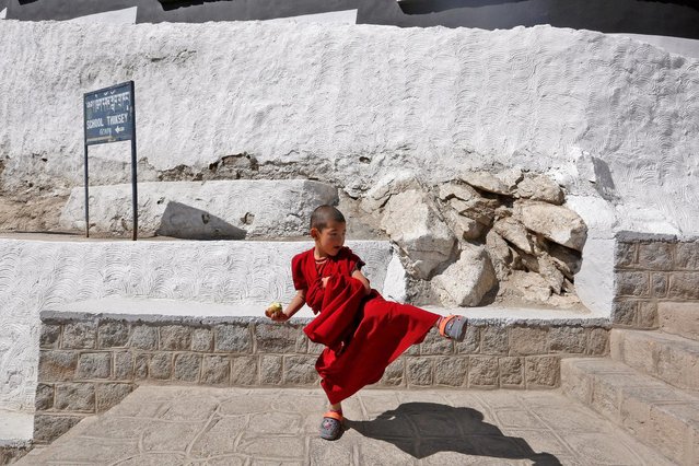 A young monk plays during a break from his studies inside Thiksey Monastery in Ladakh, India September 26, 2016. (Photo by Cathal McNaughton/Reuters)
