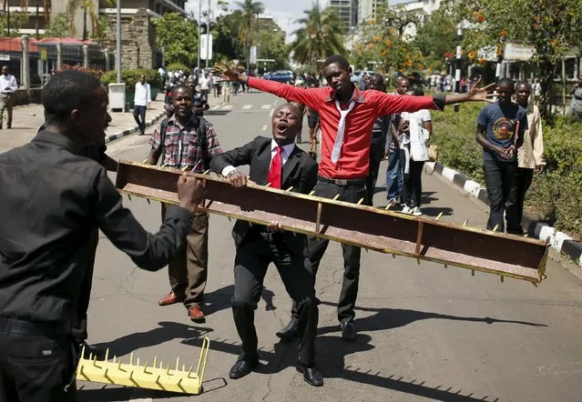 Kenyan university students participate in a demonstration against an attack by gunmen at the Garissa University College campus, along the streets of the capital Nairobi, April 7, 2015. (Photo by Goran Tomasevic/Reuters)