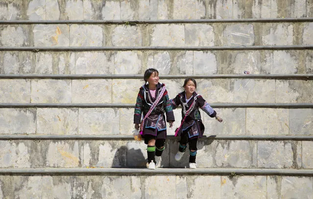 Two H'mong ethnic girls jump on the steps in Sapa, Vietnam, Thursday, February 7, 2019. (Photo by Hau Dinh)/AP Photo