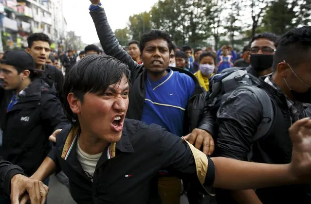 Earthquake victims chant anti-government slogans while protesting against the government's lack of aid provided to the victims in Kathmandu, Nepal April 29, 2015. The death toll from the devastating earthquake in Nepal four days ago rose past 5,000 on Wednesday as officials conceded they had made mistakes in their initial response, leaving survivors stranded in remote villages waiting for aid and relief. (Photo by Navesh Chitrakar/Reuters)
