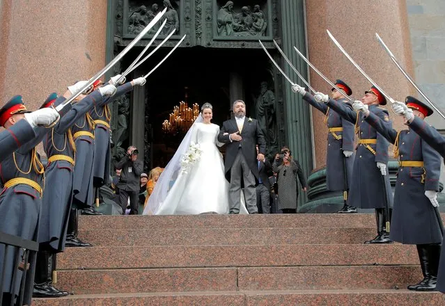 Grand Duke George Mikhailovich Romanov and Victoria Romanovna Bettarini leave St. Isaac's Cathedral after their wedding ceremony in Saint Petersburg, Russia on October 1, 2021. (Photo by Anton Vaganov/Reuters)