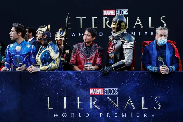 Costumed fans wait ahead of the premiere for the film “Eternals” in Los Angeles, California, U.S. on October 18, 2021. (Photo by Mario Anzuoni/Reuters)