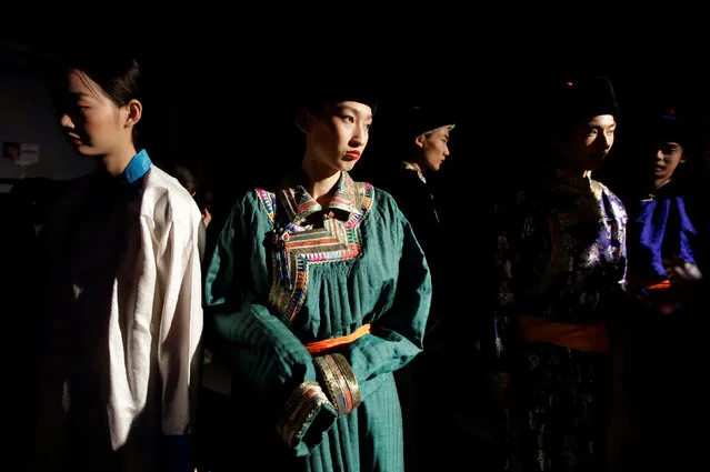 Models prepare backstage before Eji's pastoral song Autumn/Winter collection show during the China Fashion Week in Beijing, China, March 27, 2019. (Photo by Jason Lee/Reuters)