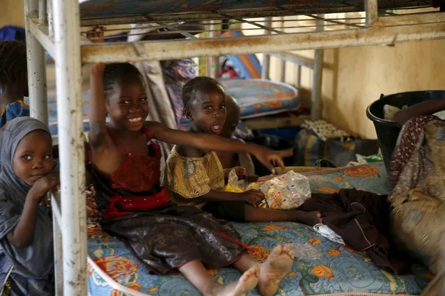 Children rescued from Boko Haram in Sambisa forest react as they rest in a room at the Internally Displaced People's camp in Yola, Nigeria May 3, 2015. (Photo by Afolabi Sotunde/Reuters)
