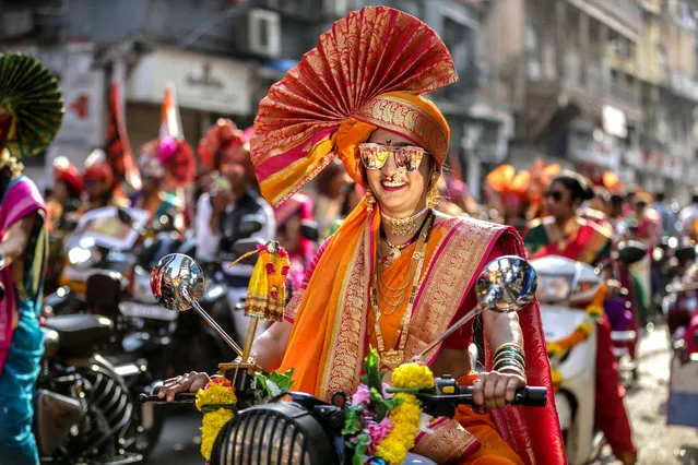 Indian people in traditional clothes take part in the procession to celebrate the Gudi Padwa, Maharashtrian's New Year in Mumbai, India, 06 April 2019. Gudi Padwa is the Hindu festival that falls on the first day of Chaitra month and marks the beginning of the Lunar Calendar, which dictates the dates for all Hindu festivals, also known as Panchang. (Photo by Divyakant Solanki/EPA/EFE)