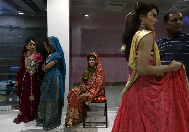 Models wait backstage during a self grooming bridal beauty workshop at a local mall in Karachi, Pakistan, March 22, 2016. (Photo by Akhtar Soomro/Reuters)