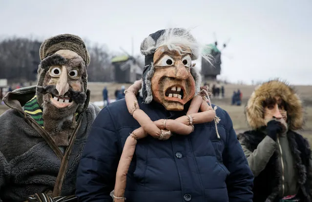 Masked revellers take part in celebration of Maslenitsa also known as Kolodiy, a pagan holiday marking the end of winter, in Kiev, Ukraine, February 26, 2017. (Photo by Vasily Fedosenko/Reuters)