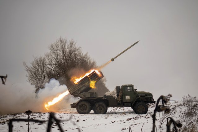 Ukrainian military fires from a multiple rocket launcher at Russian positions in the Kharkiv area, Ukraine, Saturday, February 25, 2023. The Biden administration declared its Ukraine solidarity with fresh action as well as strong words on Friday, piling sweeping new sanctions on Moscow and approving a new $2 billion weapons package to re-arm Kyiv a year after Russia's invasion. (Photo by Vadim Ghirda/AP Photo)