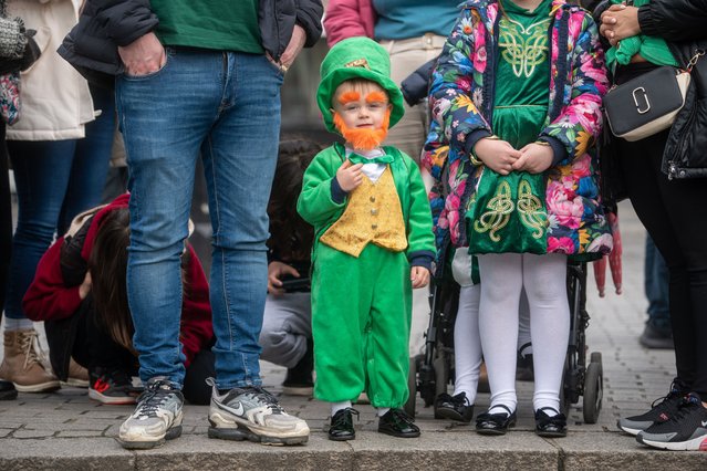 2 year old Jason is dressed as a leprechaun as he watches the St Patrick's Day Festival parade in London, United Kingdom on March 10, 2023. (Photo by Jeff Moore/The Times)