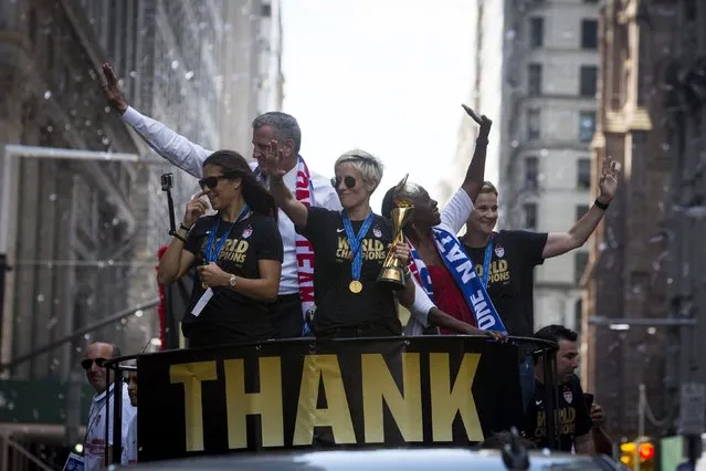 The U.S. women's soccer team cheer during the ticker tape parade to celebrate their World Cup final win over Japan on Sunday, in New York, July 10, 2015. (Photo by Andrew Kelly/Reuters)