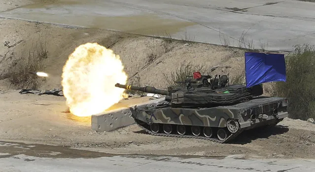 A South Korean army's K1A2 tank fires during South Korea-U.S. joint military live-fire drills at Seungjin Fire Training Field in Pocheon, South Korea, near the border with North Korea, Wednesday. April 26, 2017. (Photo by Ahn Young-joon/AP Photo)