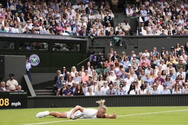 Mark Lajal of Estonia reacts as he lies on the court during his first round match against Carlos Alcaraz of Spain at the Wimbledon tennis championships in London, Monday, July 1, 2024. (Photo by Alberto PezzaliAP Photo)