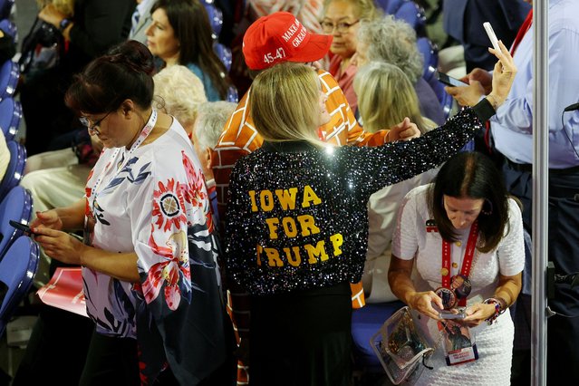 A person wearing a jacket in support Donald Trump poses on Day 1 of the RNC in Milwaukee on July 15, 2024. (Photo by Brian Snyder/Reuters)