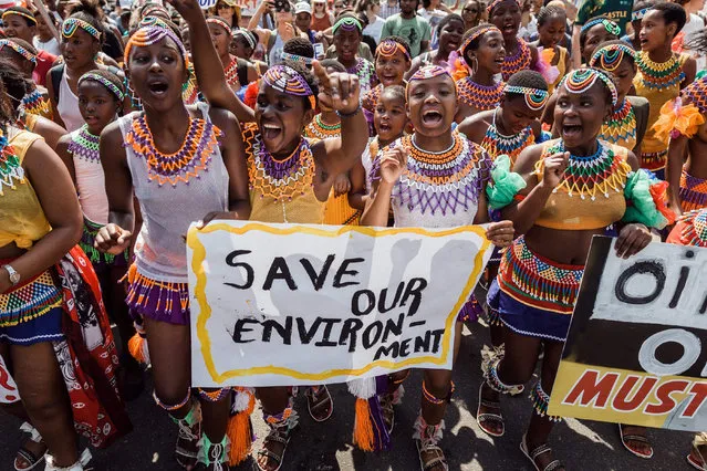 People take part in a protest for climate action on September 20, 2019 in Durban, South Africa, as part of a Global Climate action day. (Photo by Rajesh Jantilal/AFP Photo)