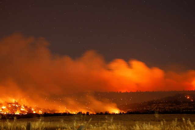 Smoke and flame rise from Park Fire burning near Chico, Californiaon July 25, 2024. (Photo by Fred Greaves/Reuters)