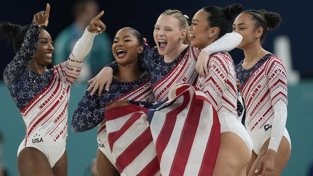 Members of Team USA celebrate after winning the gold medal during the women's artistic gymnastics team finals round at Bercy Arena at the 2024 Summer Olympics, Tuesday, July 30, 2024, in Paris, France. (Photo by Abbie Parr/AP Photo)