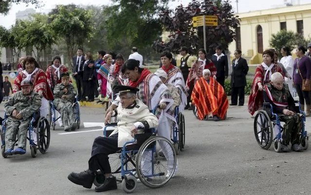 Patients in military costumes parade during Independence Day celebrations, at the Larco Herrera psychiatric hospital in Lima July 22, 2015. (Photo by Mariana Bazo/Reuters)