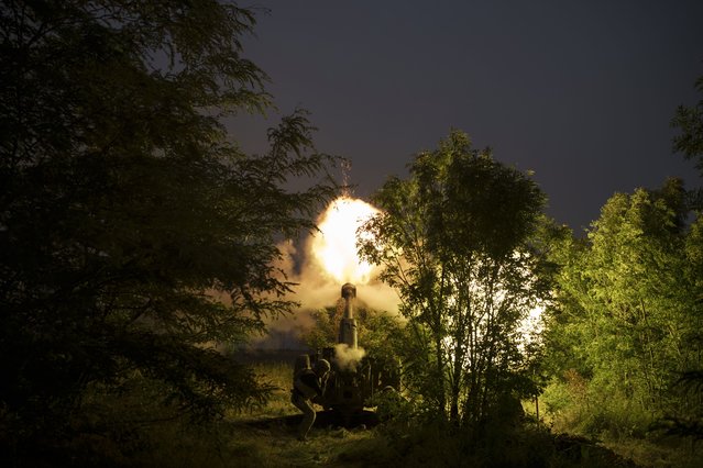 Ukraine Special Operations Forces fire a 122mm howitzer D-30 towards Russian positions in the Kherson region, Ukraine, Tuesday, June 13, 2023. (Photo by Felipe Dana/AP Photo)