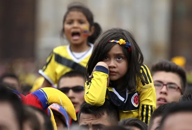 Colombia fans watch the 2014 World Cup quarter-finals between Brazil and Colombia, during a screening at Bolivar Square in Bogota July 4, 2014. (Photo by John Vizcaino/Reuters)