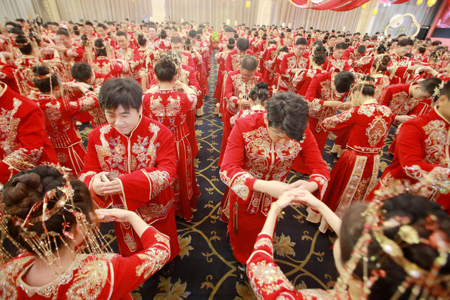 New couples attend a group wedding in Yangzhou City, east China's Jiangsu Province, 22 September, 2024. (Photo by Splash News and Pictures)