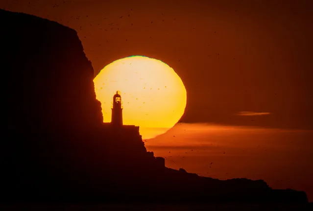 Sunrise behind the Bass Rock off the East Lothian coast near North Berwick, United Kingdom on Tuesday, April 19, 2022. (Photo by Jane Barlow/PA Images via Getty Images)