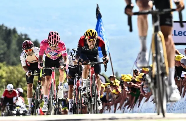 EF Education-Easypost team's Colombian rider Rigoberto Uran (2nd L) and Ineos Grenadiers team's Colombian rider Daniel Felipe Martinez (R) cycle to the finish line of the 7th stage of the 109th edition of the Tour de France cycling race, 176,3 km between Tomblaine and La Super Planche des Belles Filles, in eastern France, on July 8, 2022. (Photo by Marco Bertorello/AFP Photo)
