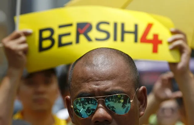 Supporters of pro-democracy group “Bersih” (Clean) gather at Central Market in Malaysia's capital city of Kuala Lumpur August 29, 2015. (Photo by Edgar Su/Reuters)