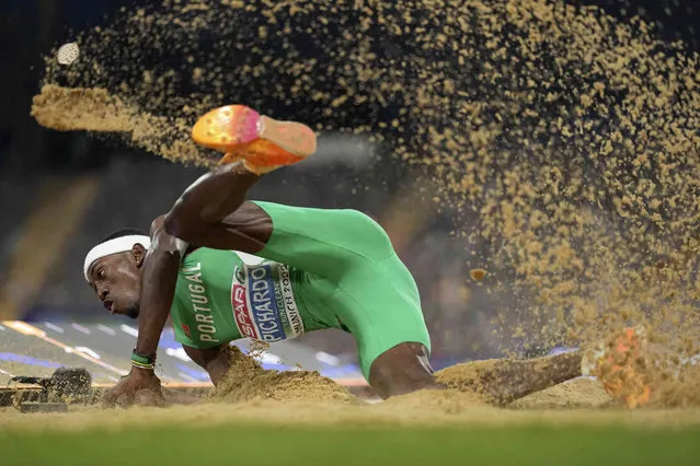 Pedro Pichardo, of Portugal, makes an attempt in the Men's triple jump final during the athletics competition in the Olympic Stadium at the European Championships in Munich, Germany, Wednesday, August 17, 2022. (Photo by Matthias Schrader/AP Photo)