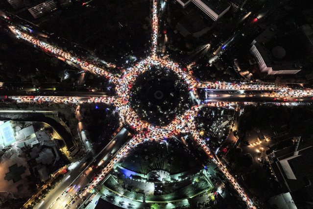 An aerial view shows Umayyad Square illuminated by headlights, as people gather in their cars to celebrate the fall of the Assad regime, on December 12, 2024 in Damascus, Syria. Rebel forces in Syria have retaken the capital from longtime ruler Bashar al-Assad, who has fled the country for Moscow. The fall of the Assad regime marks a new chapter for Syria, which has been mired in a multi-party civil war since 2011, sparked by the Arab Spring uprisings. (Photo by Ali Haj Suleiman/Getty Images)