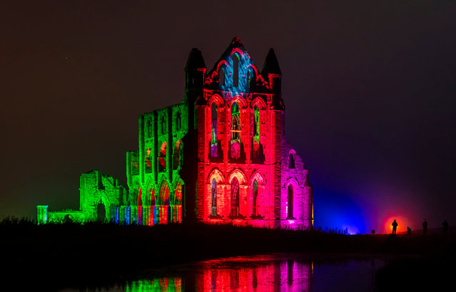 English Heritage lights up the ruins of Whitby Abbey in North Yorkshire ahead of Illuminated Abbey on Thursday, October 19, 2023. With an extended event across ten nights from 22 to 31 October, visitors can immerse themselves in the spooky goings-on at the location which inspired Bram Stoker to create “Dracula”. (Photo by Danny Lawson/PA Images via Getty Images)