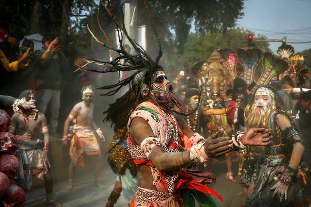 Hindu devotees smeared with ash dance during a religious procession ahead of the Maha Kumbh Mela festival in Prayagraj on January 10, 2025. (Photo by Niharika Kulkarni/AFP Photo)