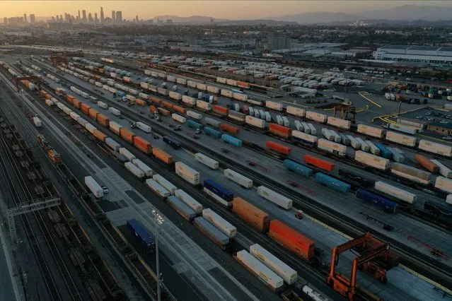 An aerial view of shipping containers and freight railway trains ahead of a possible strike if there is no deal with the rail worker unions, at the Union Pacific Los Angeles (UPLA) Intermodal Facility rail yard in Commerce, California, U.S., September 15, 2022. (Photo by Bing Guan/Reuters)
