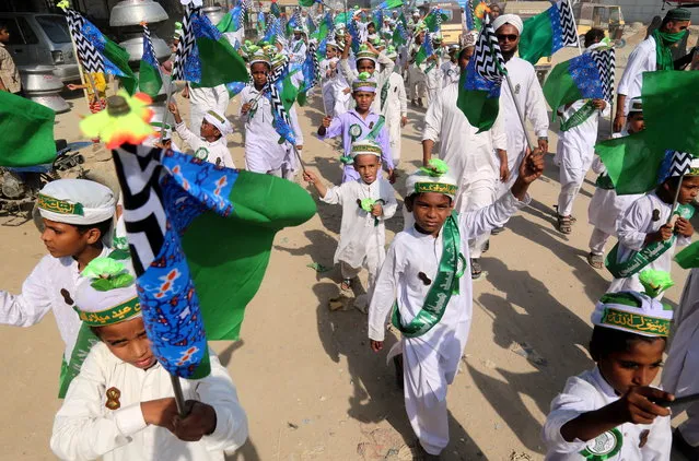 Pakistani Muslims gather during a rally ahead of Eid-Milad-ul-Nabi, the birthday of Prophet Mohammad, in Karachi, Pakistan, 04 October 2022. Eid-Milad-ul-Nabi is celebrated by Muslims every year on 12th of the Rabi-ul-Awal, the third month of the Islamic Calendar. (Photo by Rehan Khan/EPA/EFE)