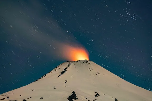 The Villarrica volcano shows signs of activity, as seen from Pucon, some 800 kilometers south of Santiago, on December 1, 2022. Villarrica volcano is among the most active in South America. (Photo by Martin Bernetti/AFP Photo)