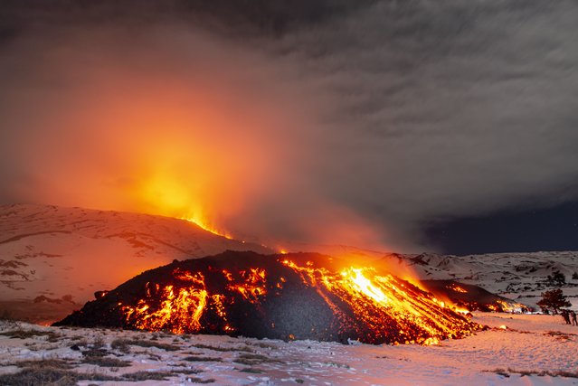 A view of Mount Etna seen from Adrano, Catania, which is producing a new eruption on 14 February 2025. A lava flow emerged from a fissure at about 3,000 metres on the southern rim of the Bocca Nuova crater. It descended along the southwest flank of the volcano, reaching an altitude of about 1,950 metres above sea level near the Galvarina shelter. The flow came within 200 metres of the Altomontana slope, where a large crowd of tourists had gathered to witness the spectacular event. (Photo by Salvatore Allegra/Anadolu via Getty Images)