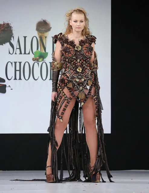 A model wears a creation made with chocolate during a fashion show at the inauguration of the 20th annual Salon du Chocolat in Paris on October 28, 2014. (Photo by David Silpa/UPI)