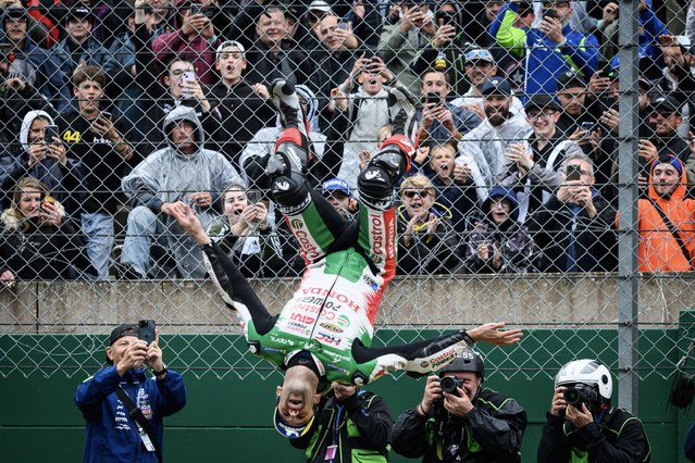 LRC Honda team's French MotoGP rider Johann Zarco celebrates with public after winning in the France Moto GP race at the Le Mans Circuit on May 11, 2025. (Photo by Loic Venance/AFP Photo)
