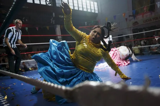 Bolivian wrestlers Yenny Mamani (front), nicknamed Martha "La Altena” and Leonor Cordova, nicknamed Angela "La Simpatica", battle during a wrestling bout in Madrid, Spain, October 8, 2015. (Photo by Juan Medina/Reuters)