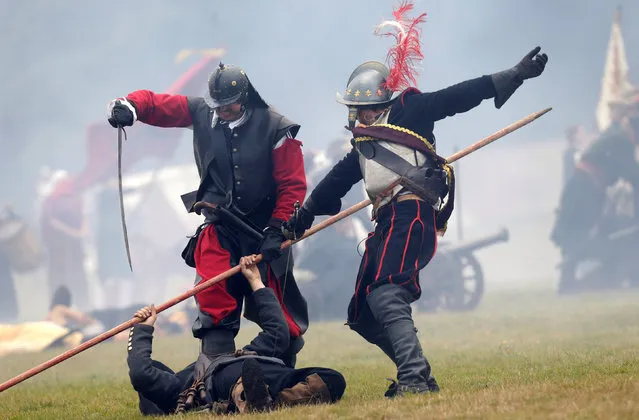 Participants wearing medieval costumes re-enact the 1620 battle of Bila Hora between Bohemian Estates and Austrian Imperial with Catholic forces in Prague, Czech Republic September 18, 2016. (Photo by David W. Cerny/Reuters)