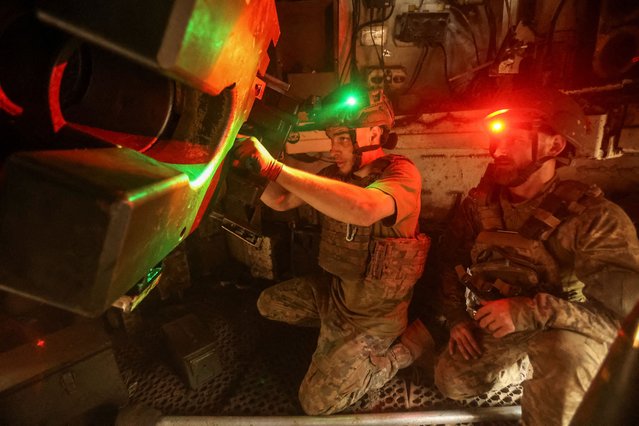 Servicemen of the 28th Separate Mechanized Brigade of the Ukrainian Armed Forces prepare to fire a M109 Paladin self-propelled howitzer towards Russian troops, near the frontline city of Toretsk in Donetsk region, Ukraine on June 2, 2025. (Photo by Anatolii Stepanov/Reuters)