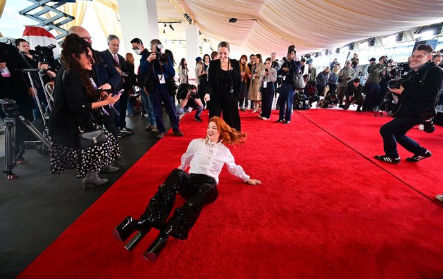 Actress Dakyta Daniela Aita rolls herself on the red carpet after its is rolled out ahead of the 96th Annual Academy Awards at the Dolby Theatre in Hollywood, California on March 6, 2024. The 96th Annual Academy Awards will be held on March 10. (Photo by Frederic J. Brown/AFP Photo)